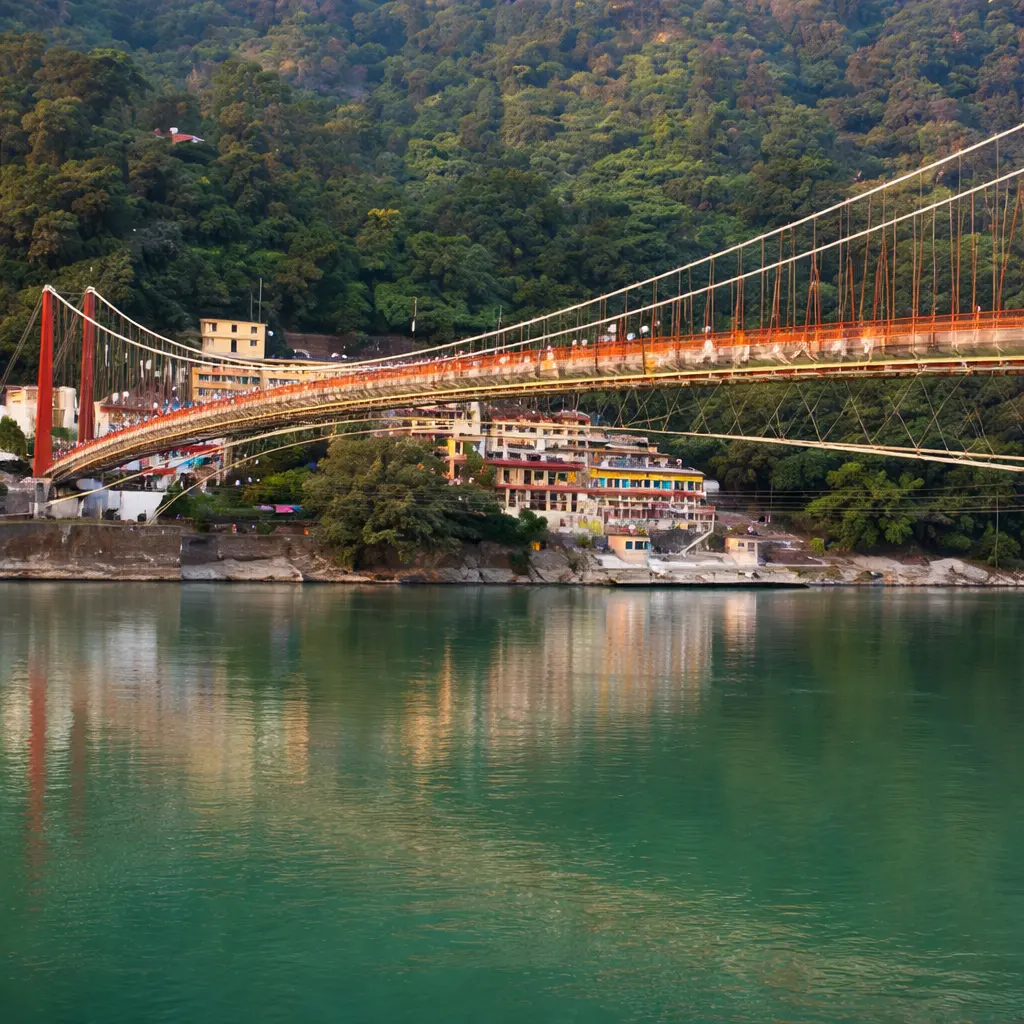 Ram Jhula suspension bridge over the Ganga River in Rishikesh, connecting Sivananda Ashram and Swargashram, surrounded by scenic hills and temples